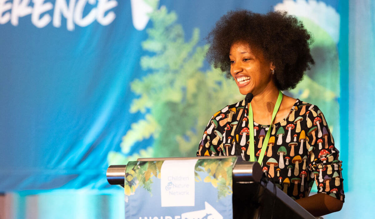 Atiya Wells accepts the Richard Louv award.