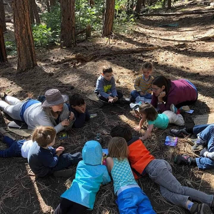 Kids sitting around in a circle.