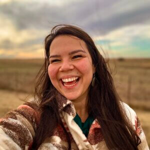 Headshot of Jacqueline Bennett smiling outside in field