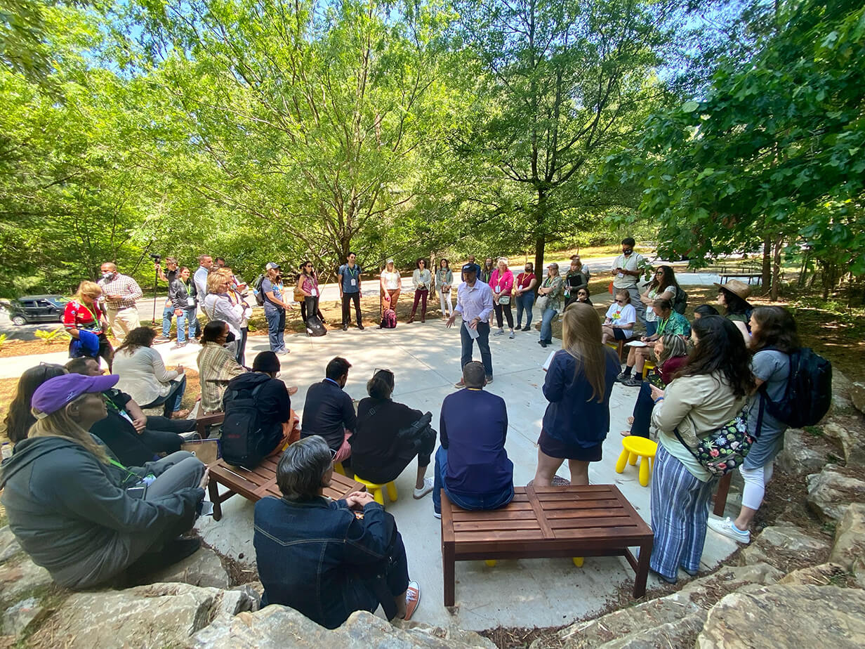 Jay Wozniak of the Trust for Public Land speaks during a tour of Miles Elementary, an Atlanta Community Schoolyard site