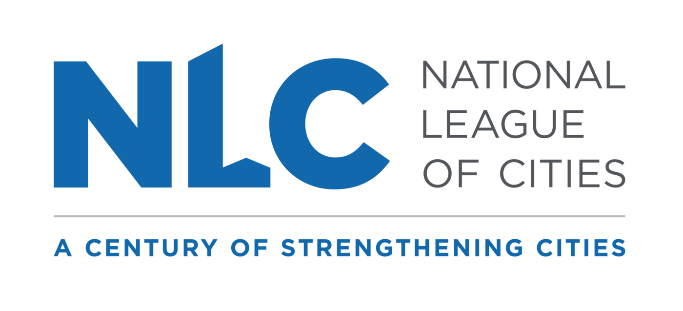 Logo for the National League of Cities (NLC), featuring large blue letters ‘NLC’ on a black background, with the words ‘National League of Cities’ in gray to the right and the tagline ‘A Century of Strengthening Cities’ beneath.