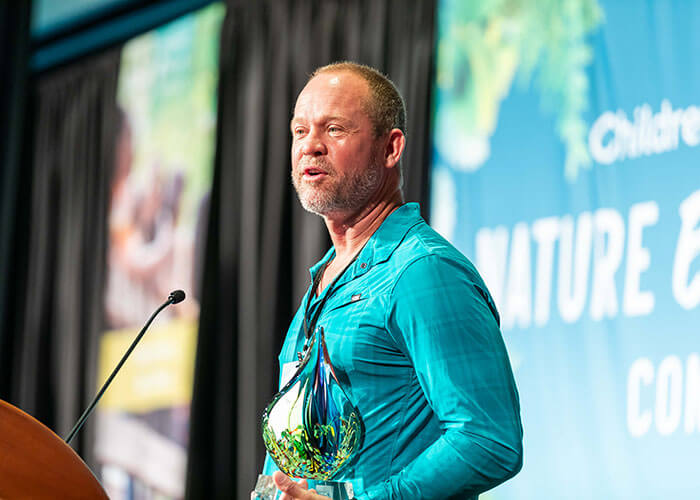 Jason Stout speaking at a conference.