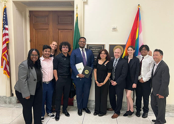Group posing in a government building.