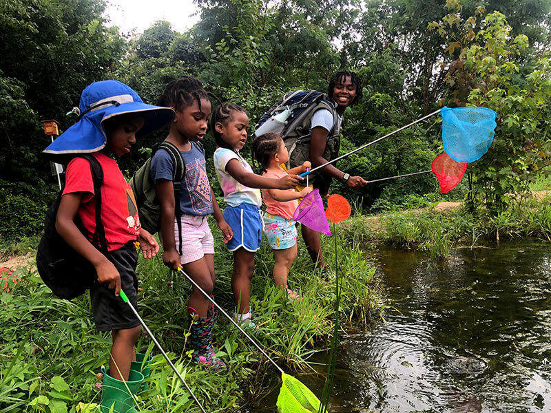 BLISS Meadows hosts a variety of natural areas for children to explore. Photo courtesy of Backyard Basecamp.