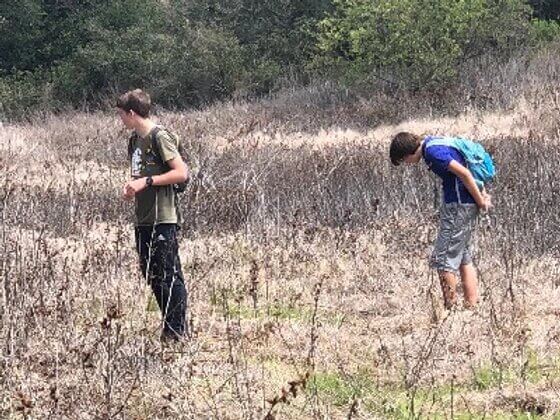 two teenagers in a field