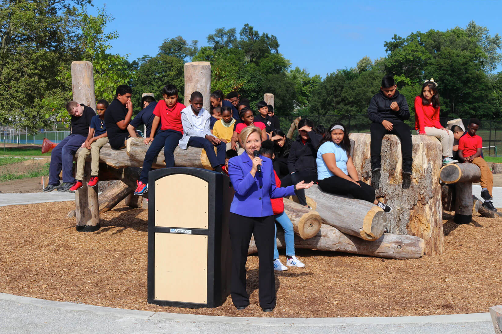 Group of children with news anchor.