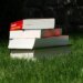 stack of books on grass