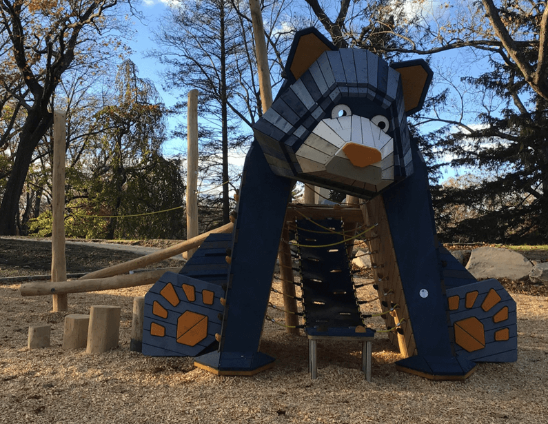 A bear-shaped climbing structure made of wood and metal at Roger Williams Park’s Bear Ground playground. Photo credit: Providence Parks Department.