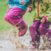 Kids jumping in puddles.