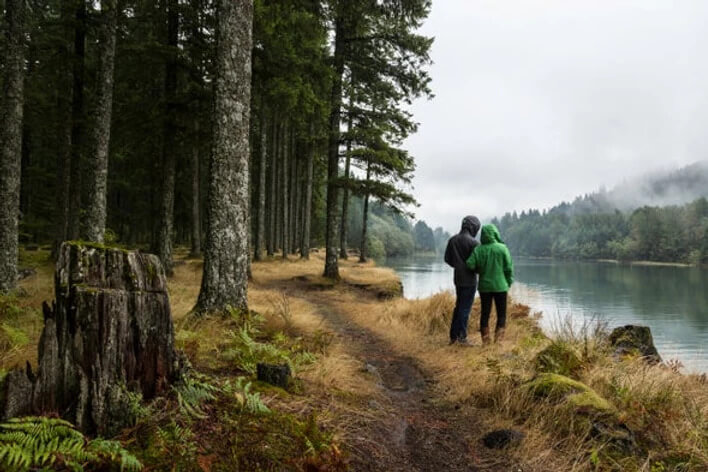 couple looking out towards a lake