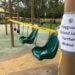 playground with sign that says it's close