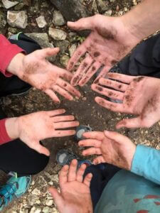 kids hands covered in dirt