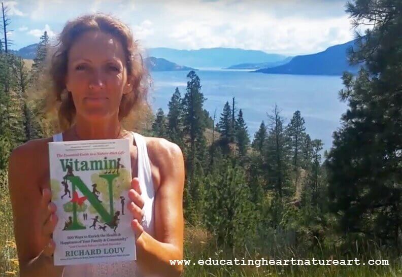 person holding up a book